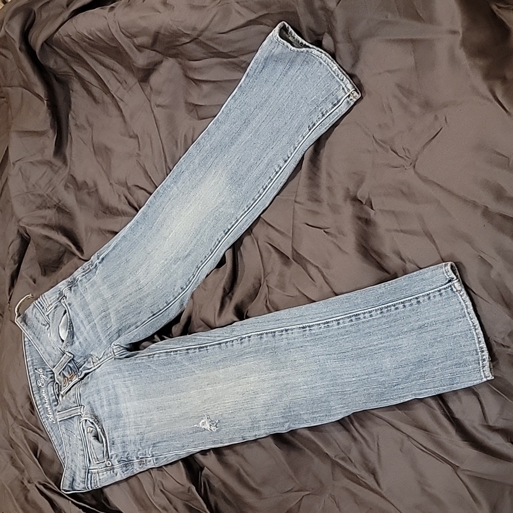 AE light blue distressed American Eagle Jean's Artist cut.